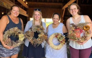 Four students of the Broccolo Tree & Lawn Care workshop for making wreaths